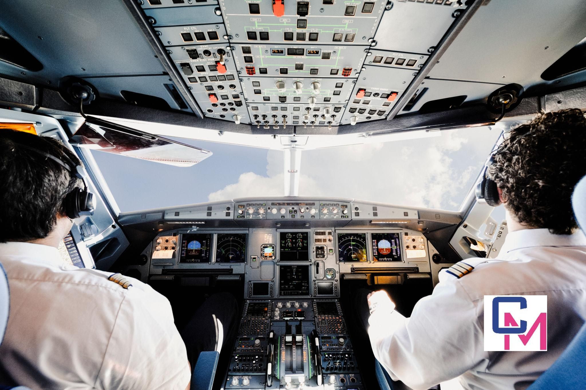 Commercial airline cockpit with pilots monitoring flight instruments